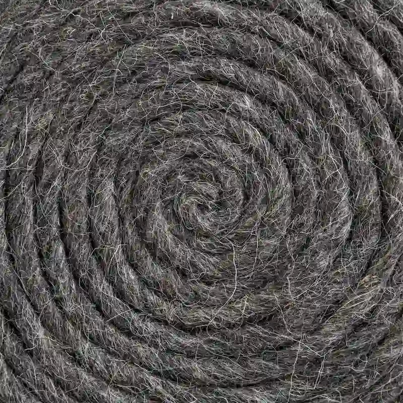 Coussin rond en laine tressée marron